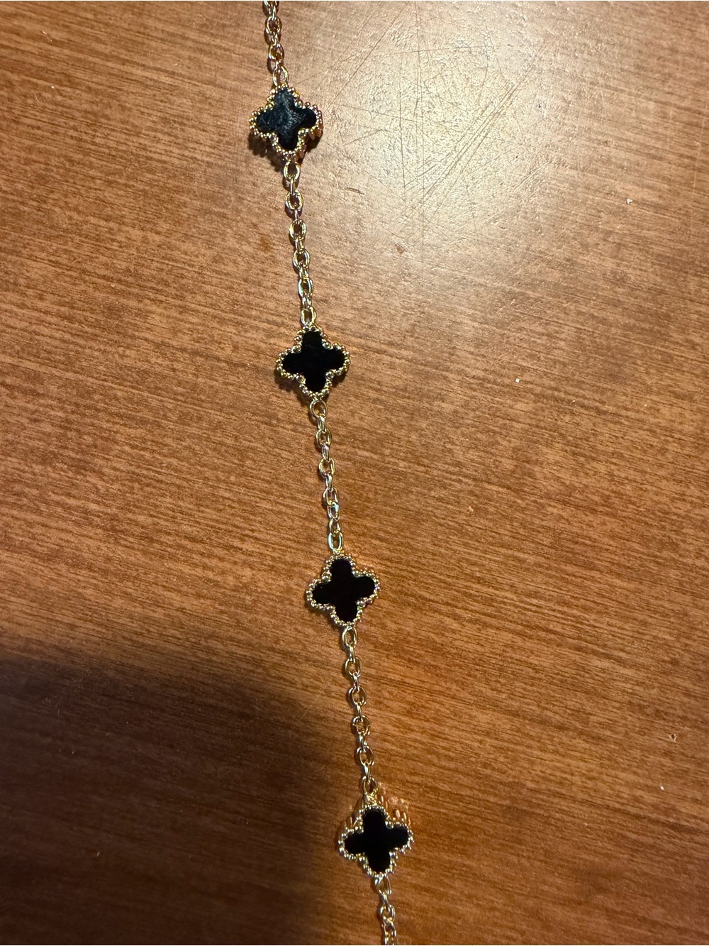 Gold Chain Bracelet with Black Clover Accents